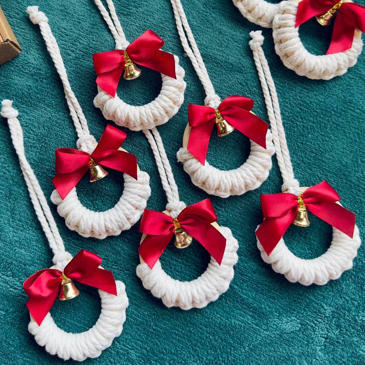 Cotton Christmas ornament with red ribbon and gold bell